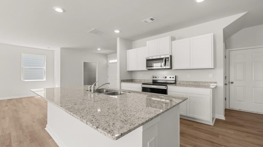 33 Rolling Mdw Trace Jasper, GA 30143 - Photo 6 of 38 a kitchen with stainless steel appliances granite countertop a sink a stove and a refrigerator