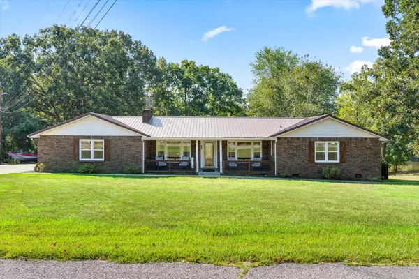 a front view of a house with yard