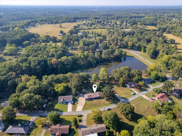 an aerial view of a houses with a lake view