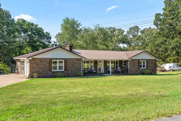 a front view of a house with yard