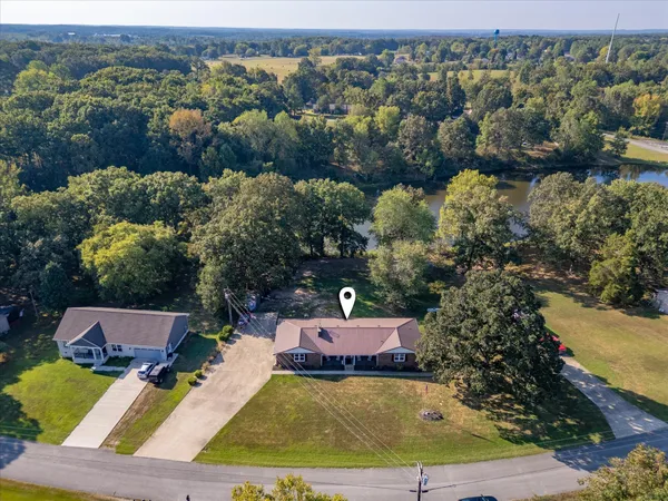 an aerial view of a house with a swimming pool