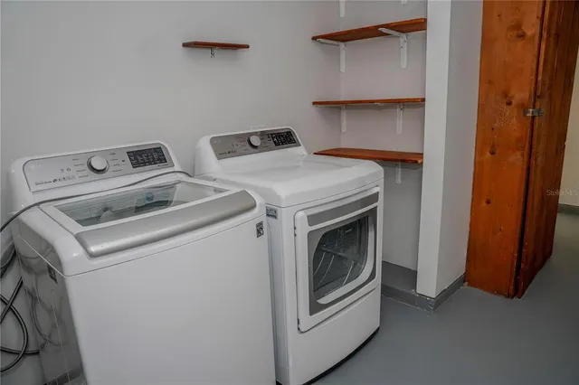 a utility room with dryer and washer