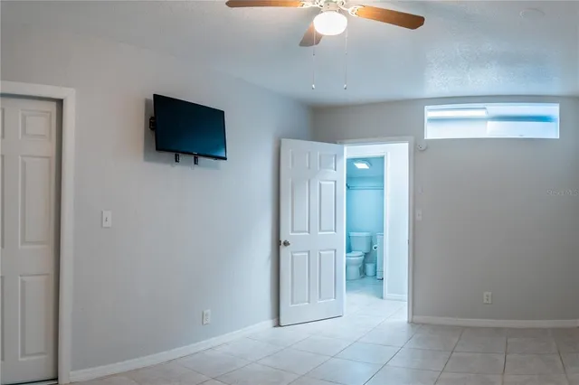a view of a livingroom with an empty space & a flat screen tv