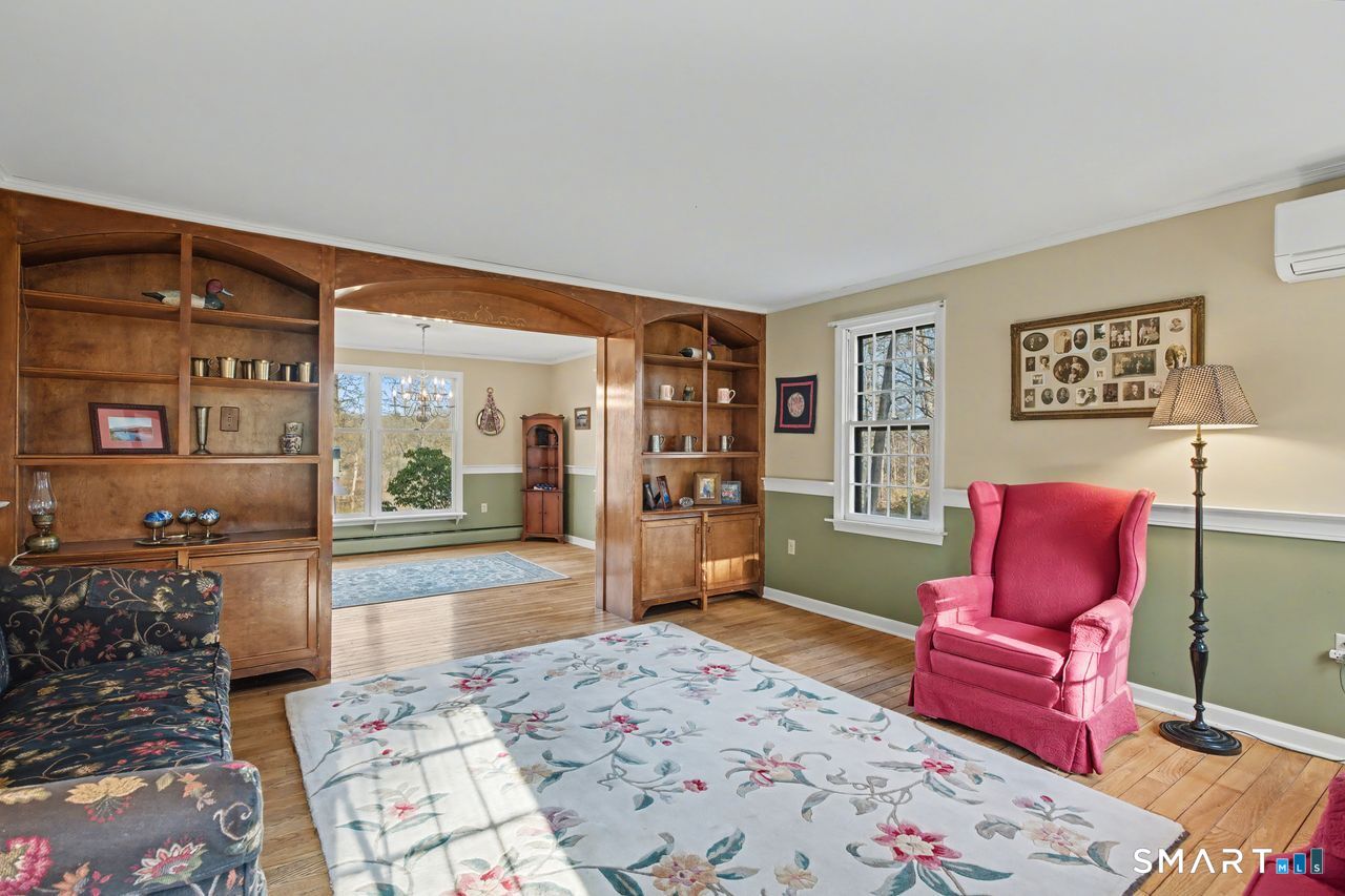 226 Middlesex Avenue Chester, CT 06412 - Photo 11 of 40 a bedroom with a bed and wooden floor
