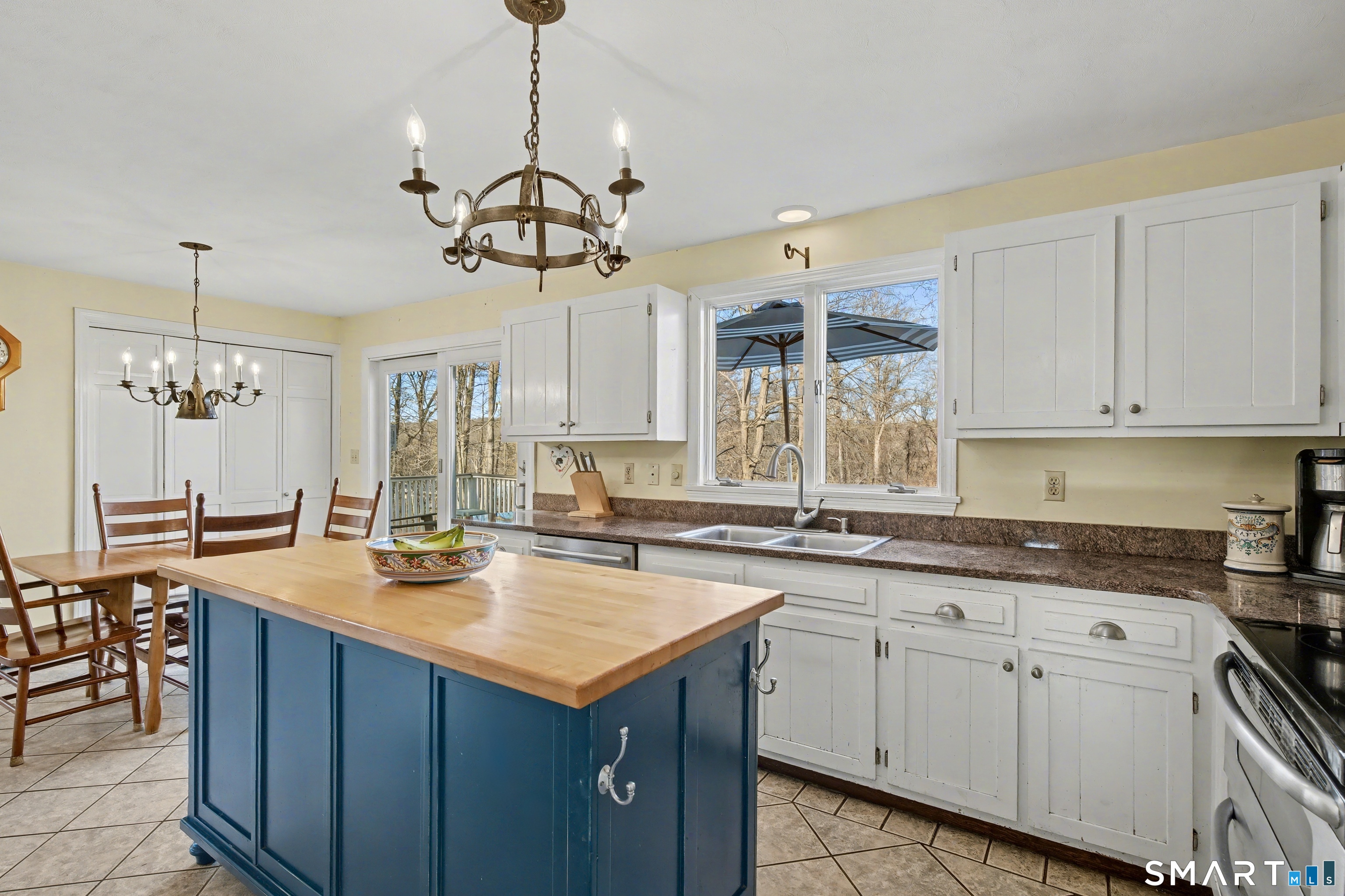 226 Middlesex Avenue Chester, CT 06412 - Photo 13 of 40 a kitchen with a sink a stove and cabinets