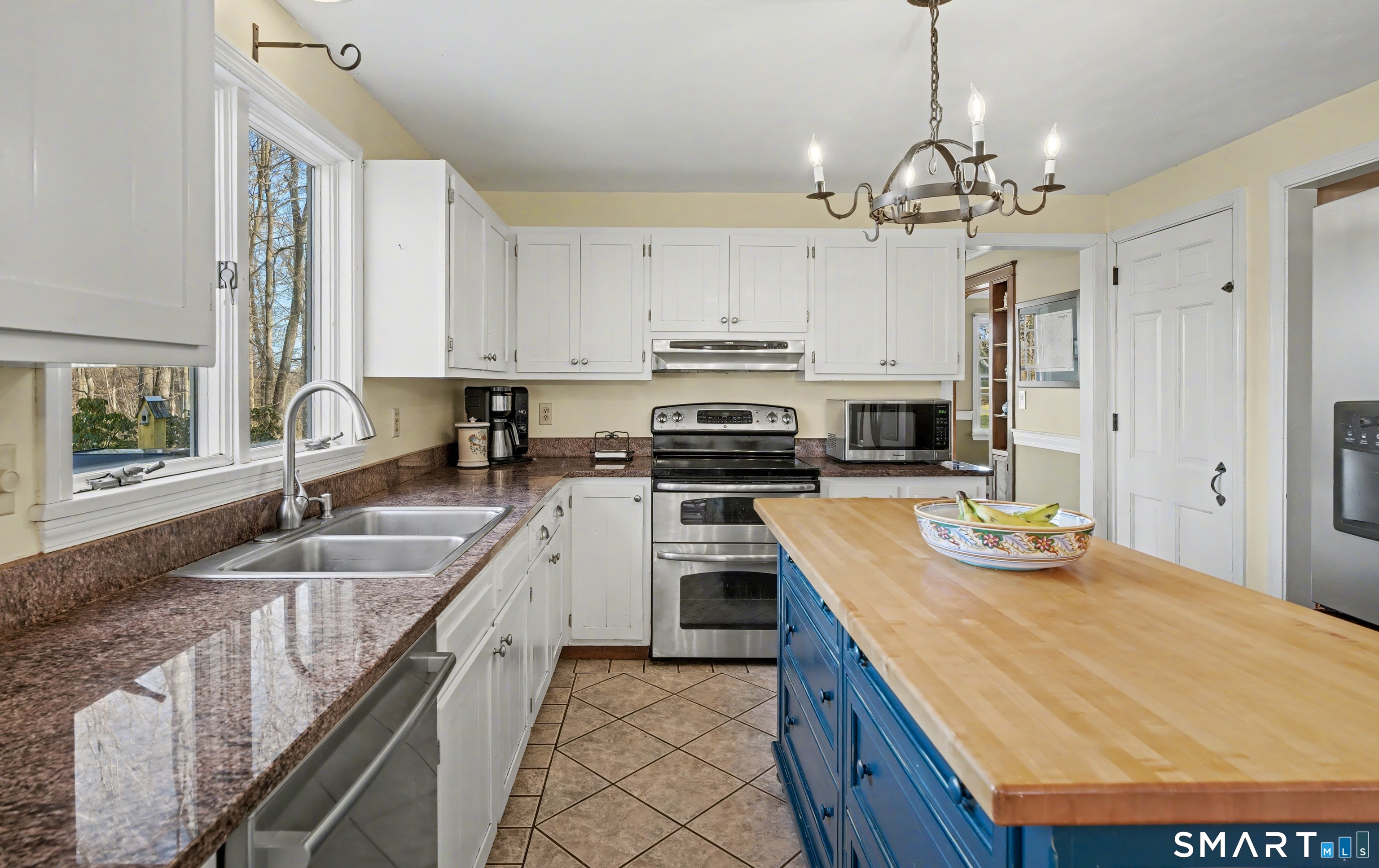 226 Middlesex Avenue Chester, CT 06412 - Photo 15 of 40 a kitchen with stainless steel appliances granite countertop a sink and cabinets