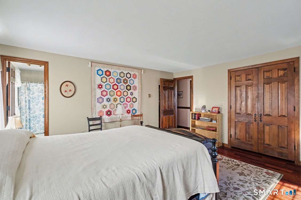 226 Middlesex Avenue Chester, CT 06412 - Photo 21 of 40 a bedroom with a bed and a window