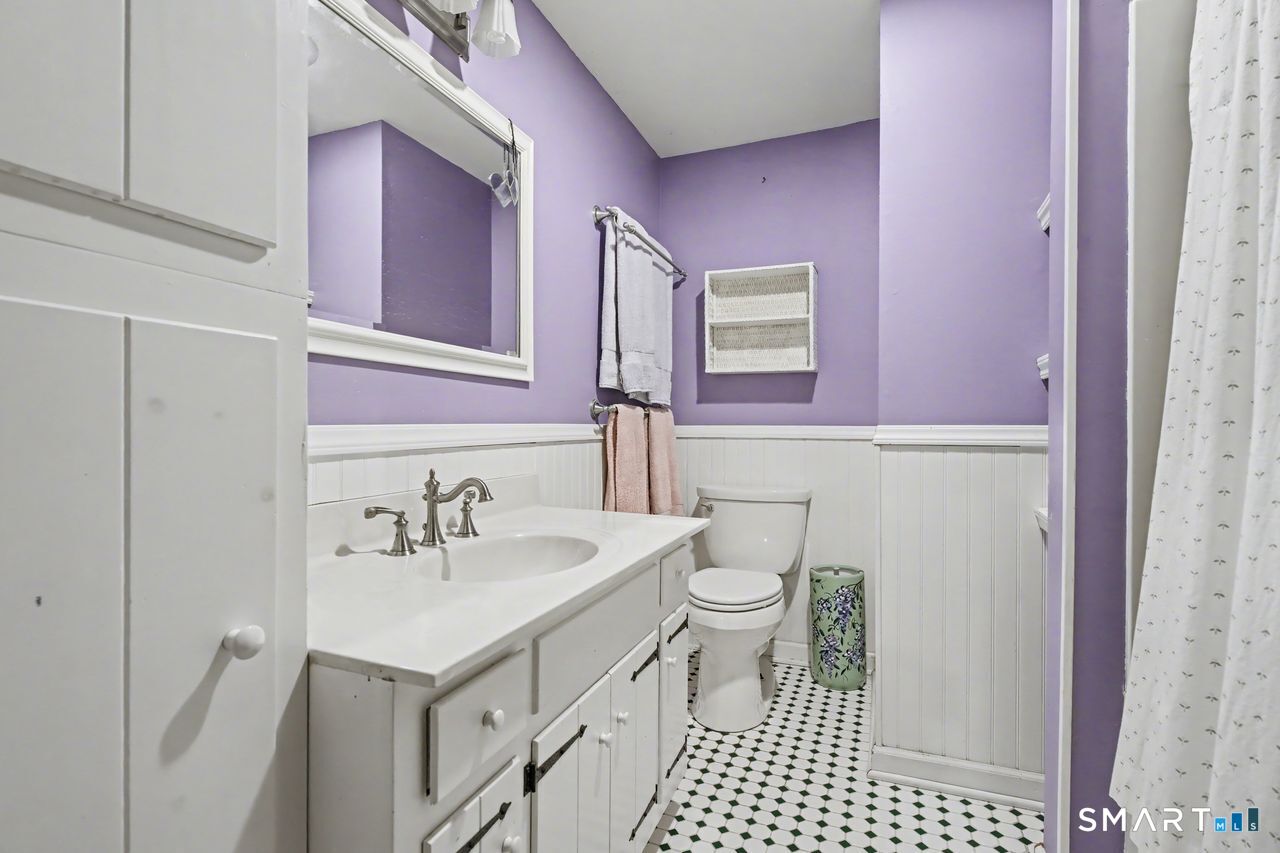 226 Middlesex Avenue Chester, CT 06412 - Photo 25 of 40 a bathroom with a sink a toilet a mirror and shower