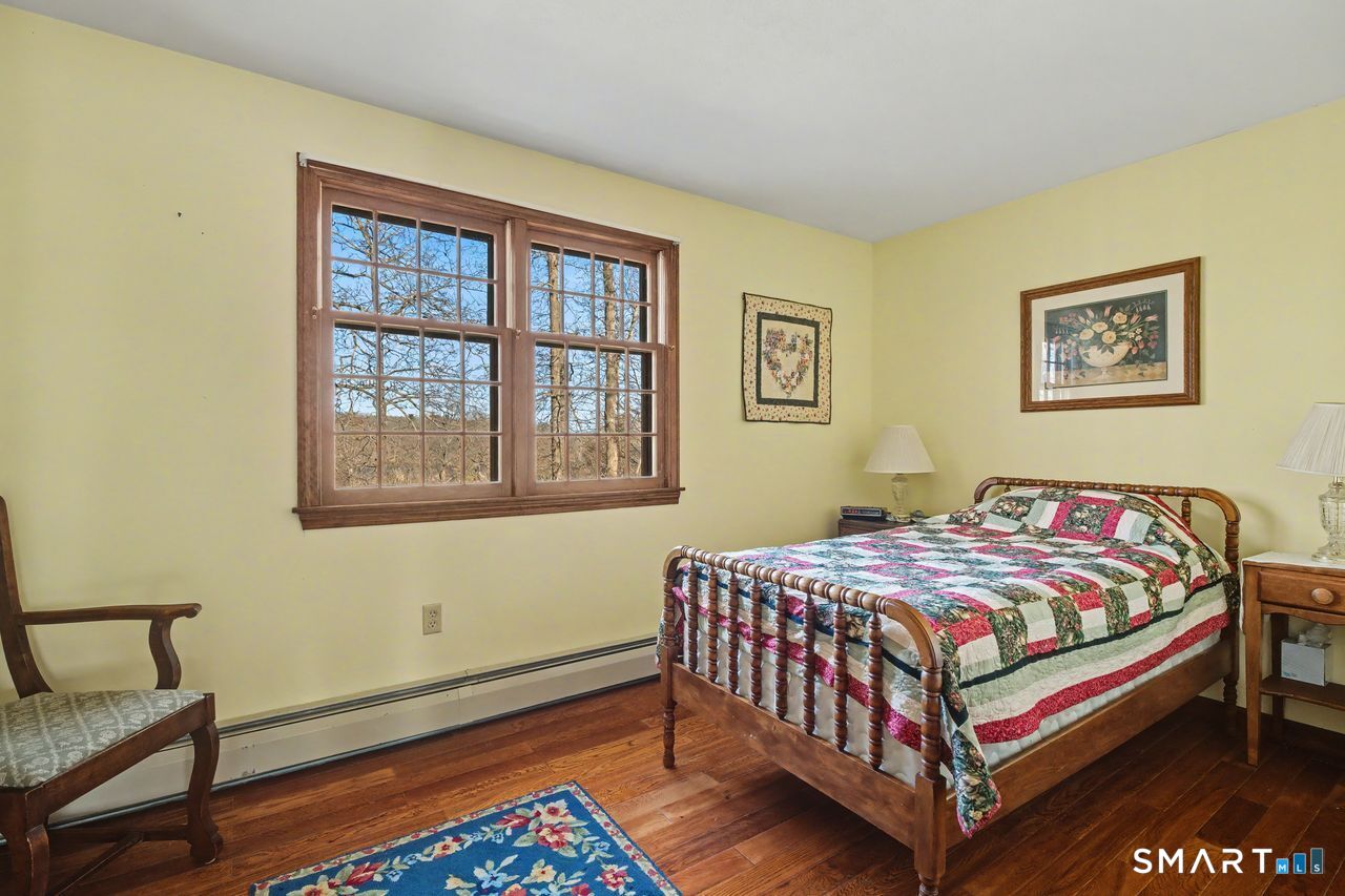 226 Middlesex Avenue Chester, CT 06412 - Photo 26 of 40 a bedroom with a bed and a window
