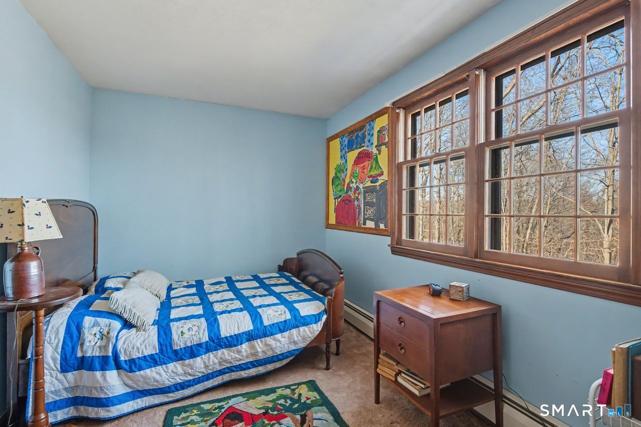 226 Middlesex Avenue Chester, CT 06412 - Photo 27 of 40 a bedroom with furniture and a window