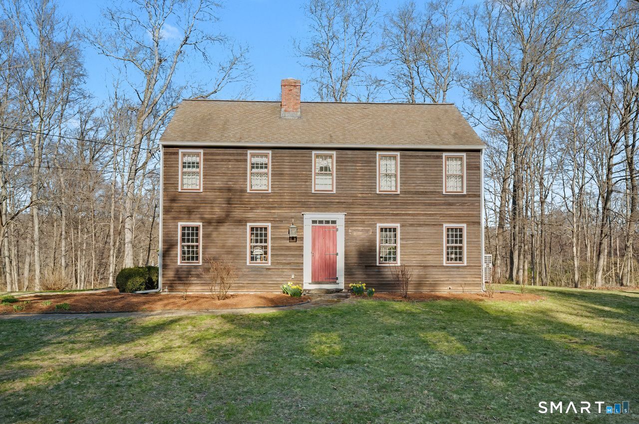 226 Middlesex Avenue Chester, CT 06412 - Photo 28 of 40 a view of a house with a yard