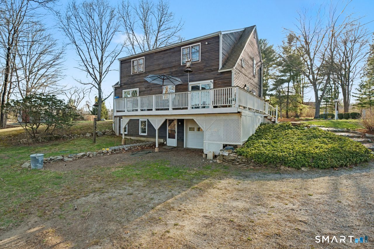 226 Middlesex Avenue Chester, CT 06412 - Photo 29 of 40 a view of a house with a yard