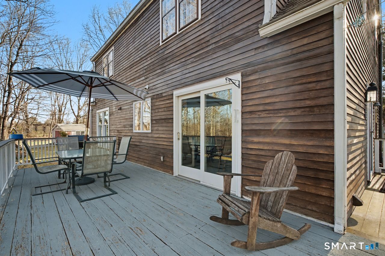 226 Middlesex Avenue Chester, CT 06412 - Photo 31 of 40 a patio with table and chairs
