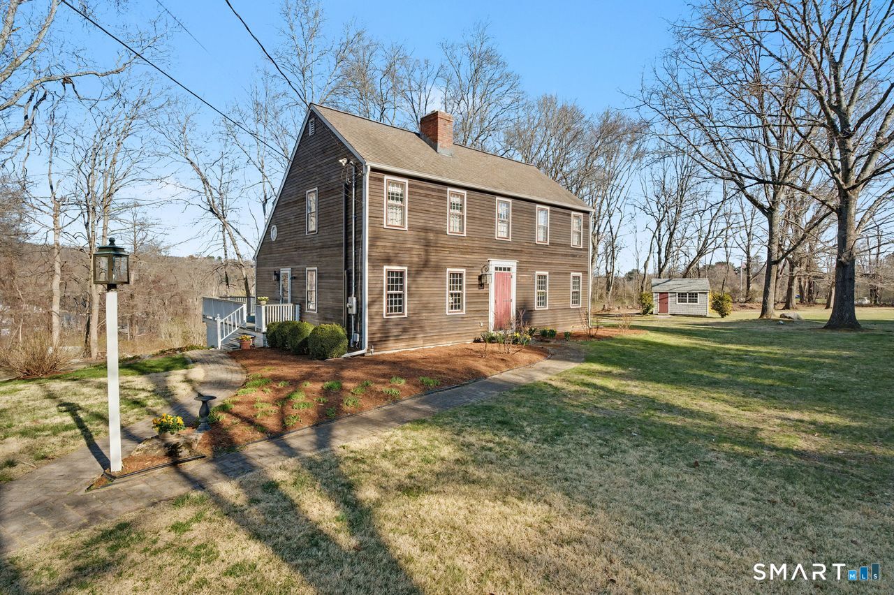 226 Middlesex Avenue Chester, CT 06412 - Photo 33 of 40 a front view of a house with a yard