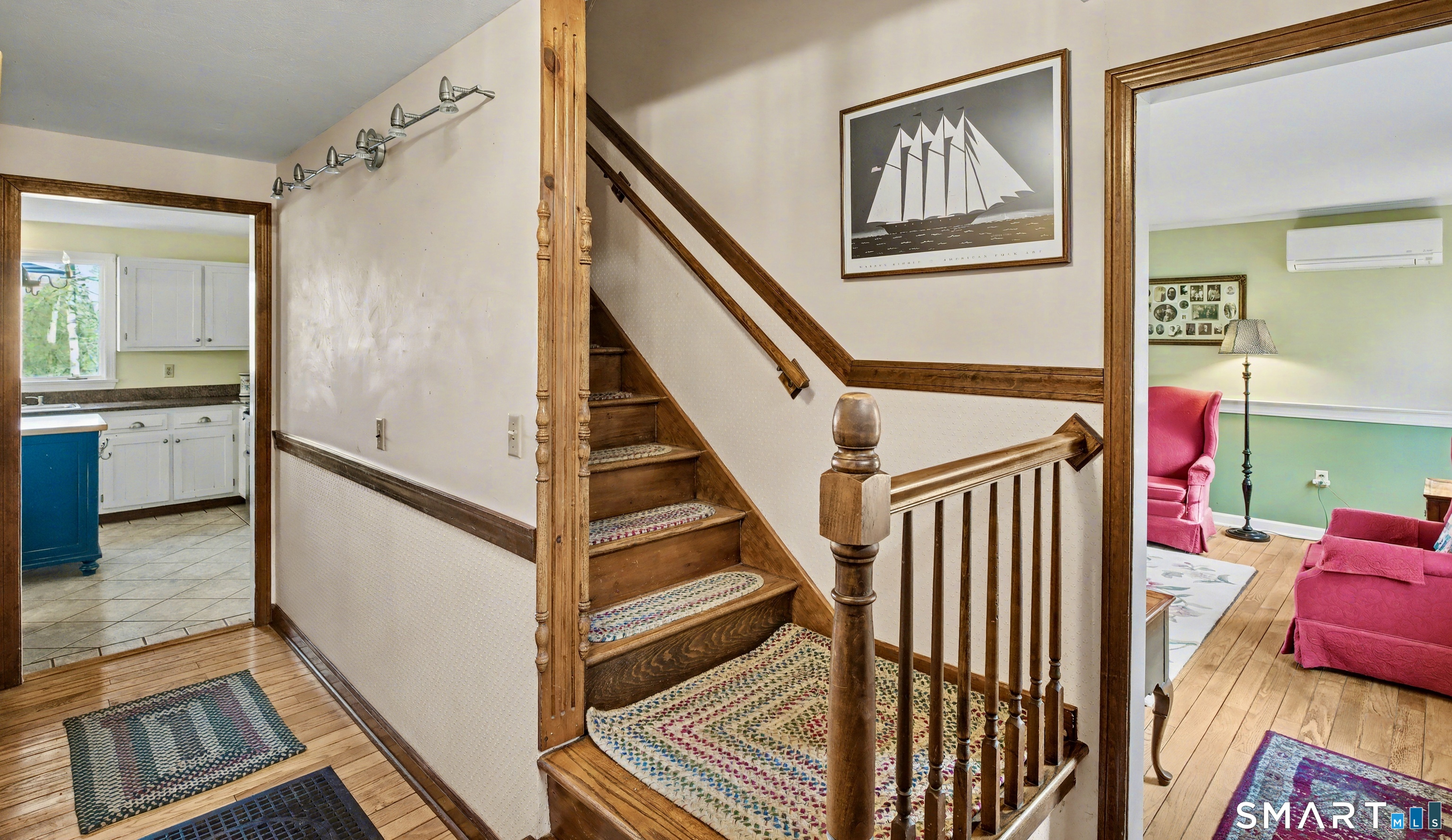226 Middlesex Avenue Chester, CT 06412 - Photo 7 of 40 a view of an entryway with wooden floor and windows