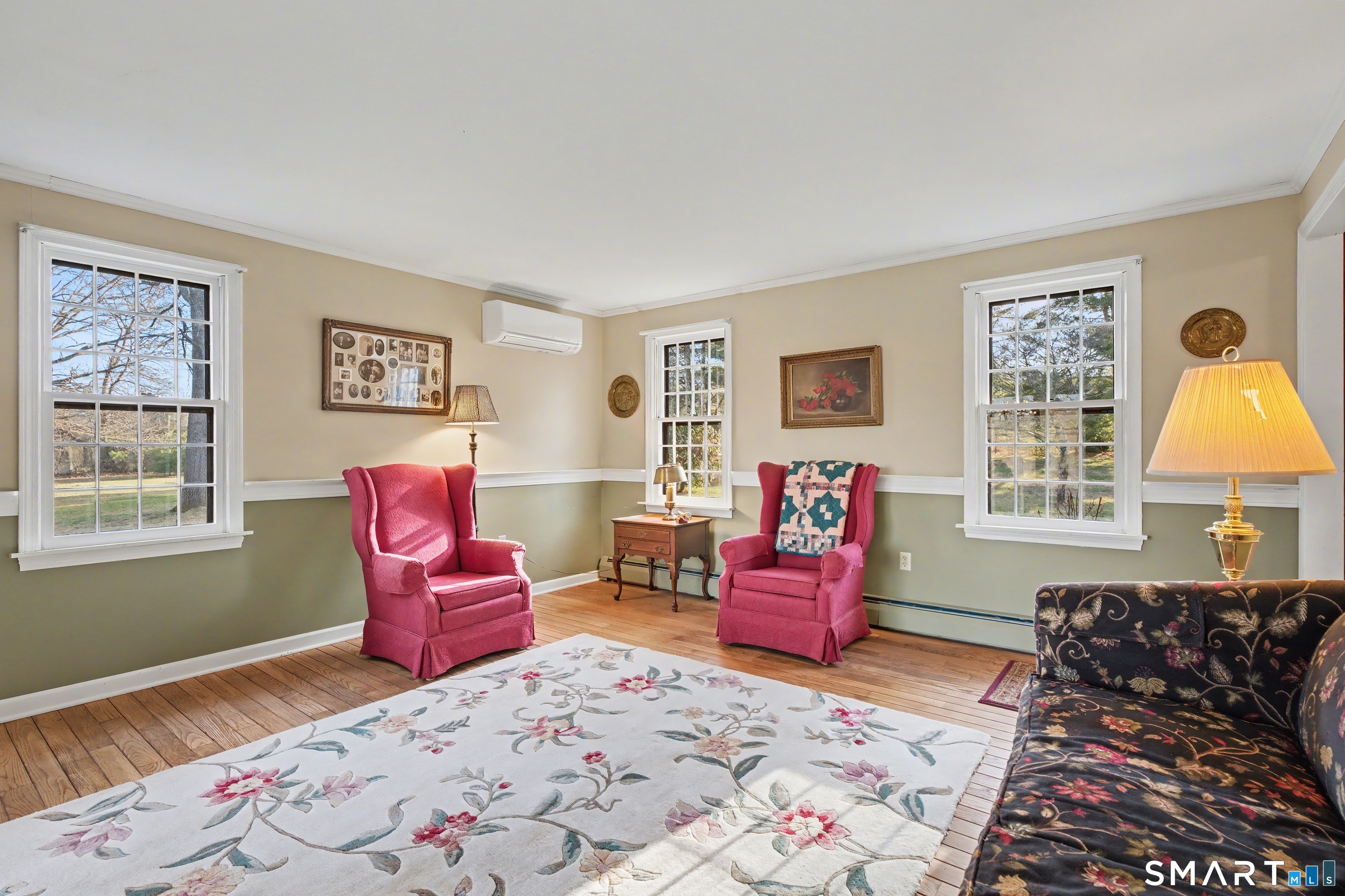 226 Middlesex Avenue Chester, CT 06412 - Photo 8 of 40 a bedroom with a bed and wooden floor