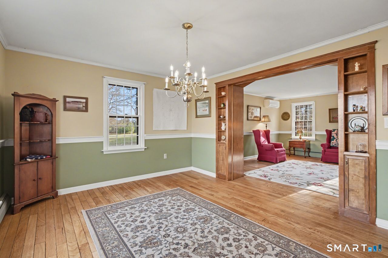 226 Middlesex Avenue Chester, CT 06412 - Photo 10 of 40 a living room with furniture and a chandelier