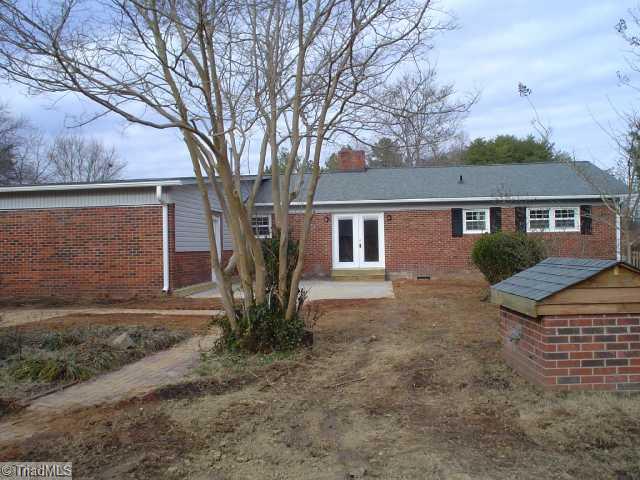 Exterior Back. 1 1/2 acres, lots of room for cars or storage