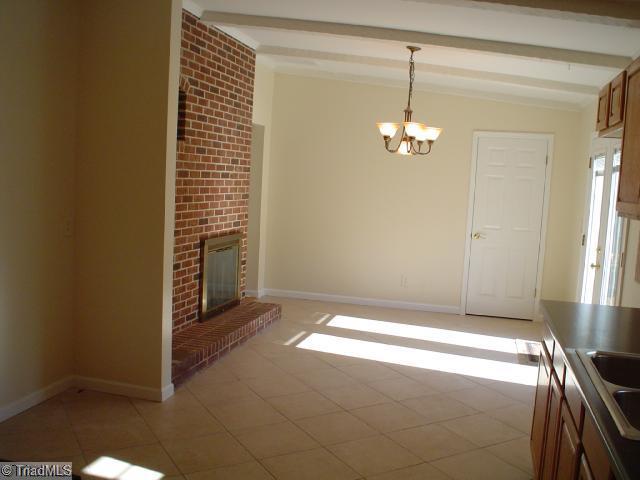 Dining Room. Dining area off kitchen with fireplace