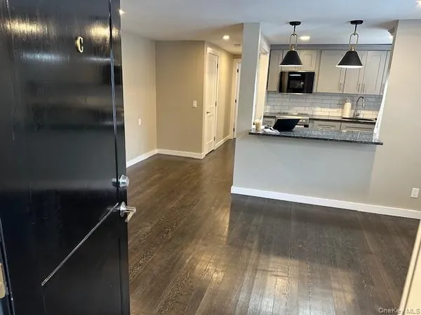 a view of kitchen with microwave and stove