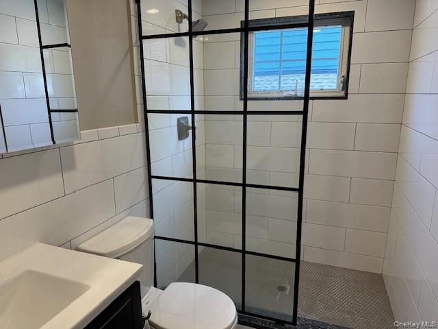 377 Fort Salonga Road Northport, NY 11768 - Photo 3 of 5 a bathroom with a toilet and a shower