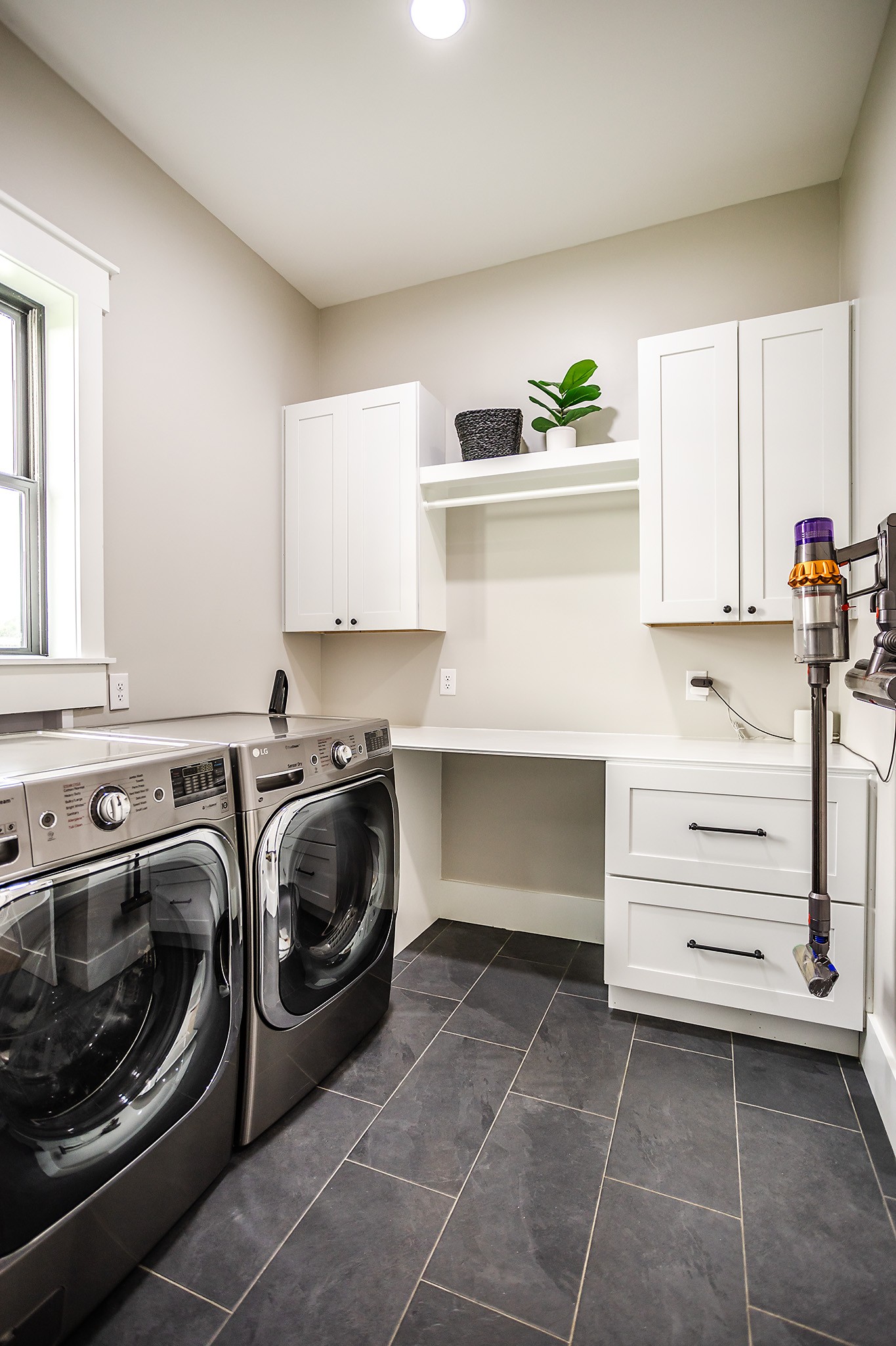 1143 Maxwell Branch Road Cottontown, TN 37048 - Photo 35 of 64 a utility room with cabinets dryer and washer