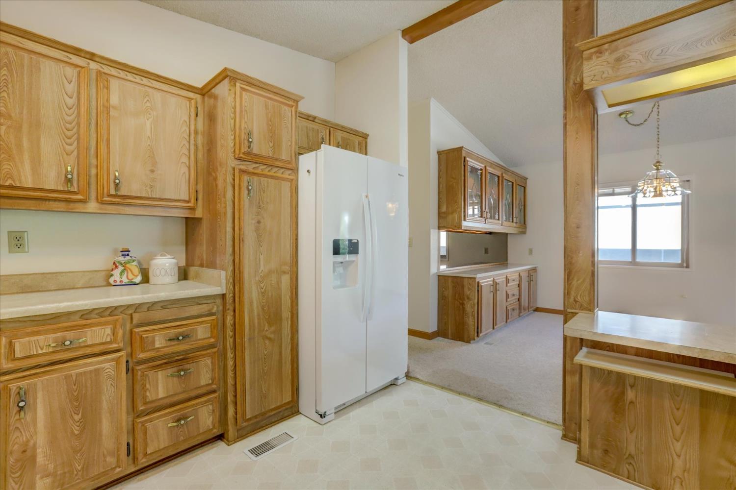 10046 Dalewood Way Grass Valley, CA 95949 - Photo 16 of 68 a kitchen with stainless steel appliances granite countertop a refrigerator and cabinets