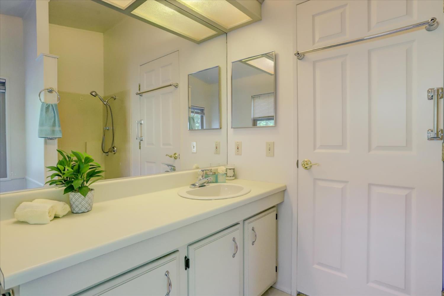 10046 Dalewood Way Grass Valley, CA 95949 - Photo 23 of 68 a bathroom with a sink a vanity and a mirror