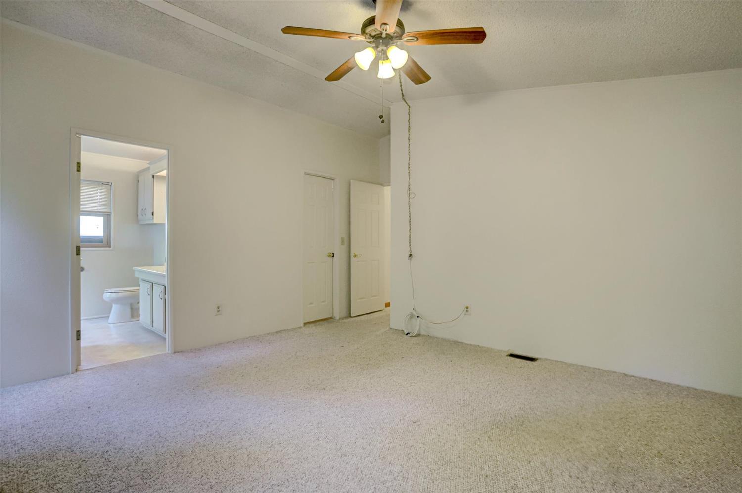 10046 Dalewood Way Grass Valley, CA 95949 - Photo 27 of 68 an empty room with a fan and a fan