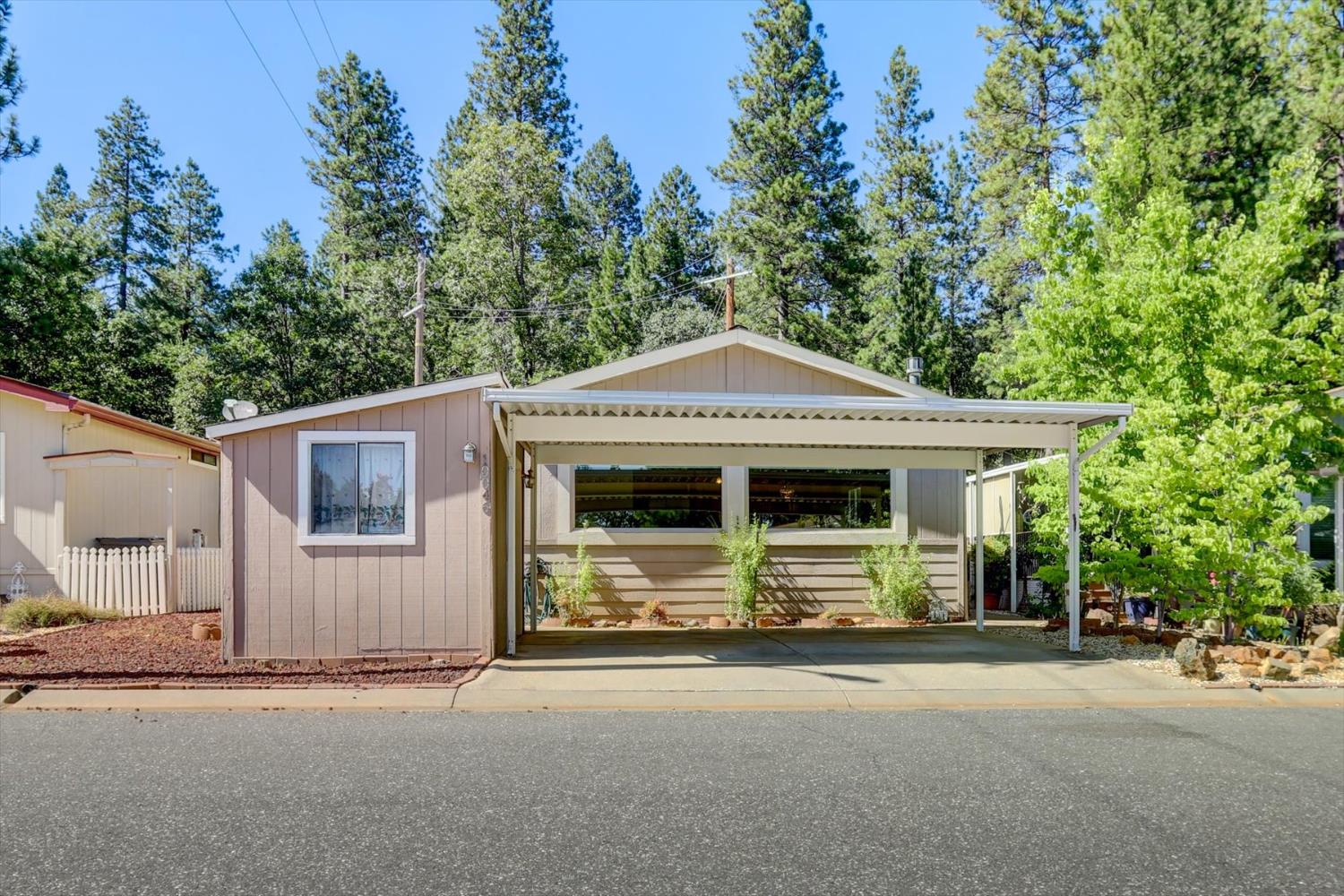 10046 Dalewood Way Grass Valley, CA 95949 - Photo 32 of 68 a front view of a house with a garage