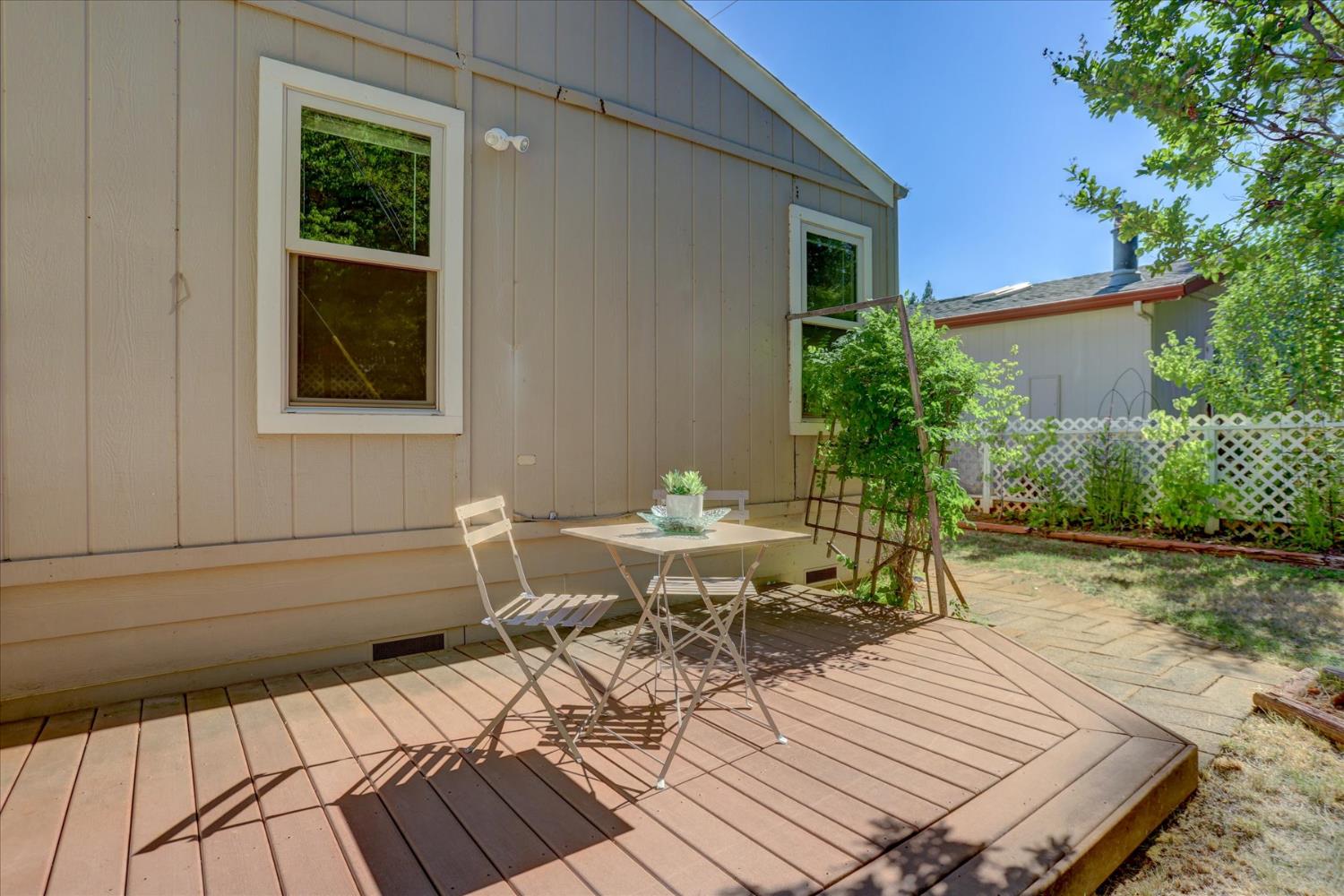 10046 Dalewood Way Grass Valley, CA 95949 - Photo 42 of 68 a view of a roof deck with table and chairs and potted plants
