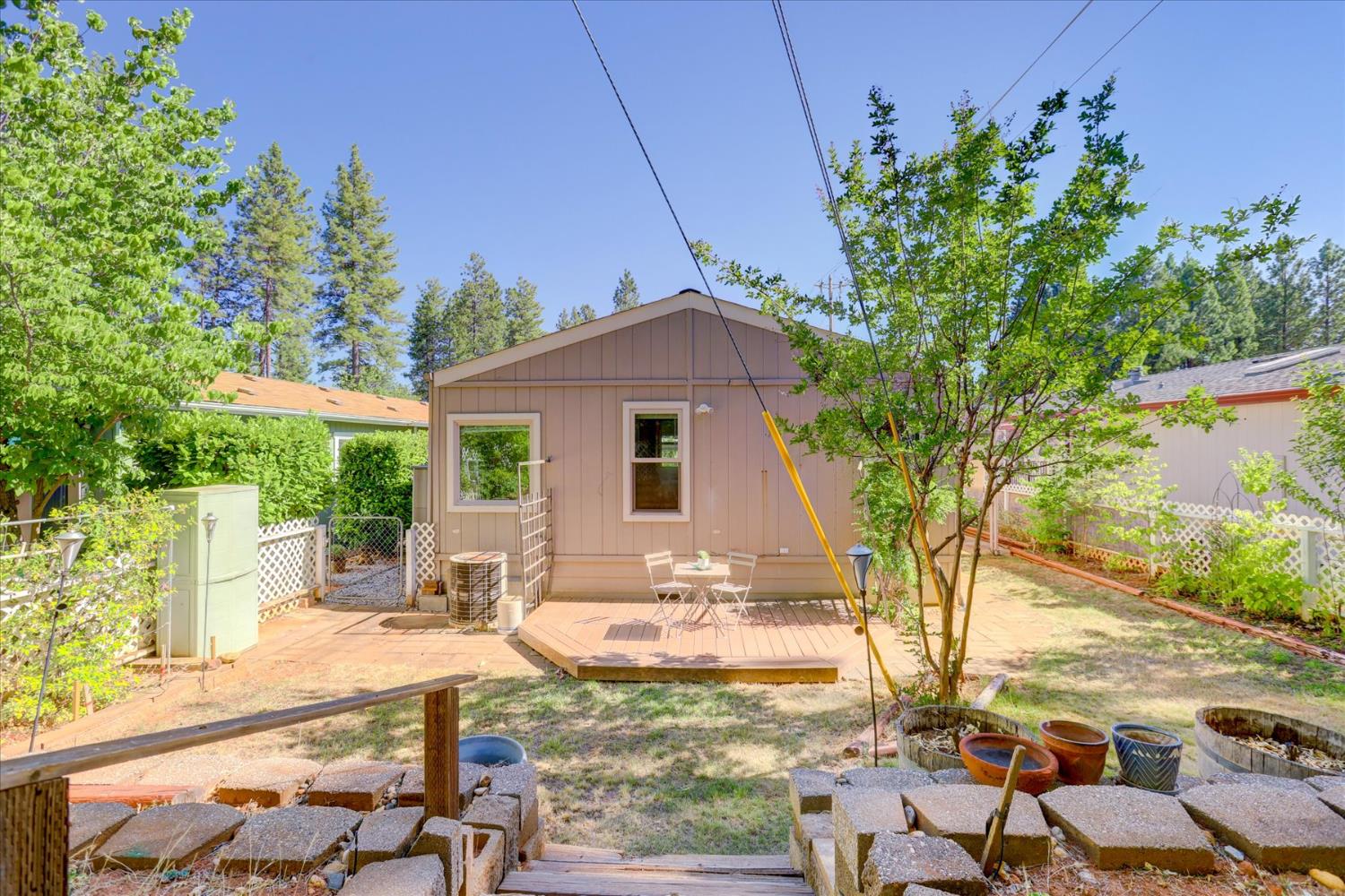 10046 Dalewood Way Grass Valley, CA 95949 - Photo 47 of 68 a view of a house with backyard and sitting area