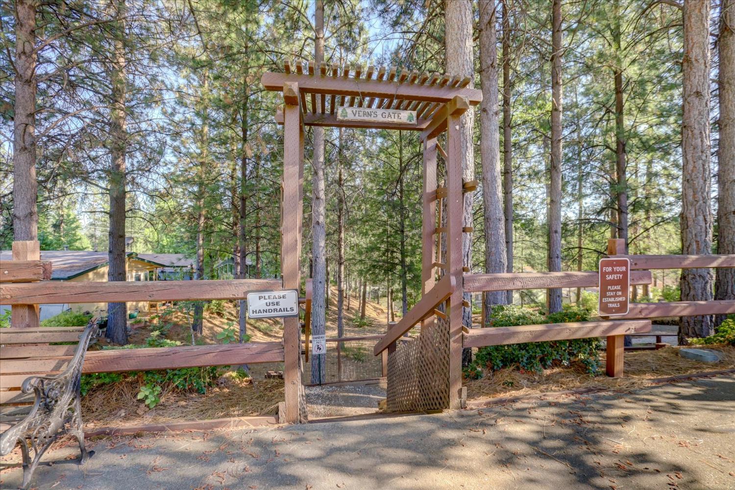 10046 Dalewood Way Grass Valley, CA 95949 - Photo 52 of 68 a view of a wooden bench with wooden fence