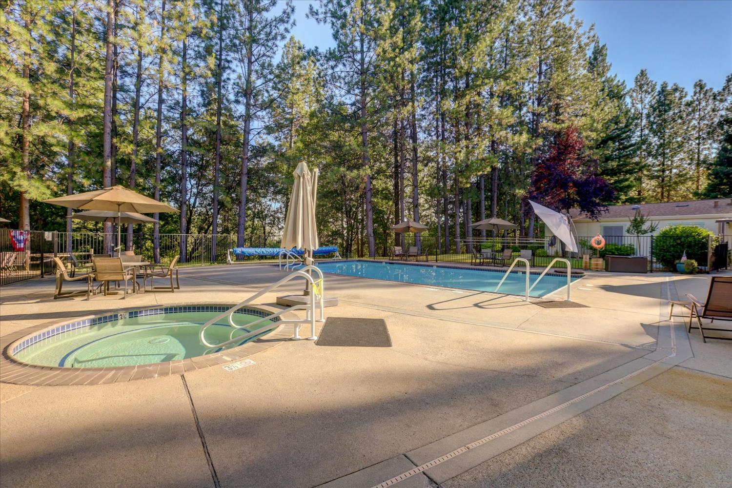 10046 Dalewood Way Grass Valley, CA 95949 - Photo 66 of 68 a view of a swimming pool with sitting area