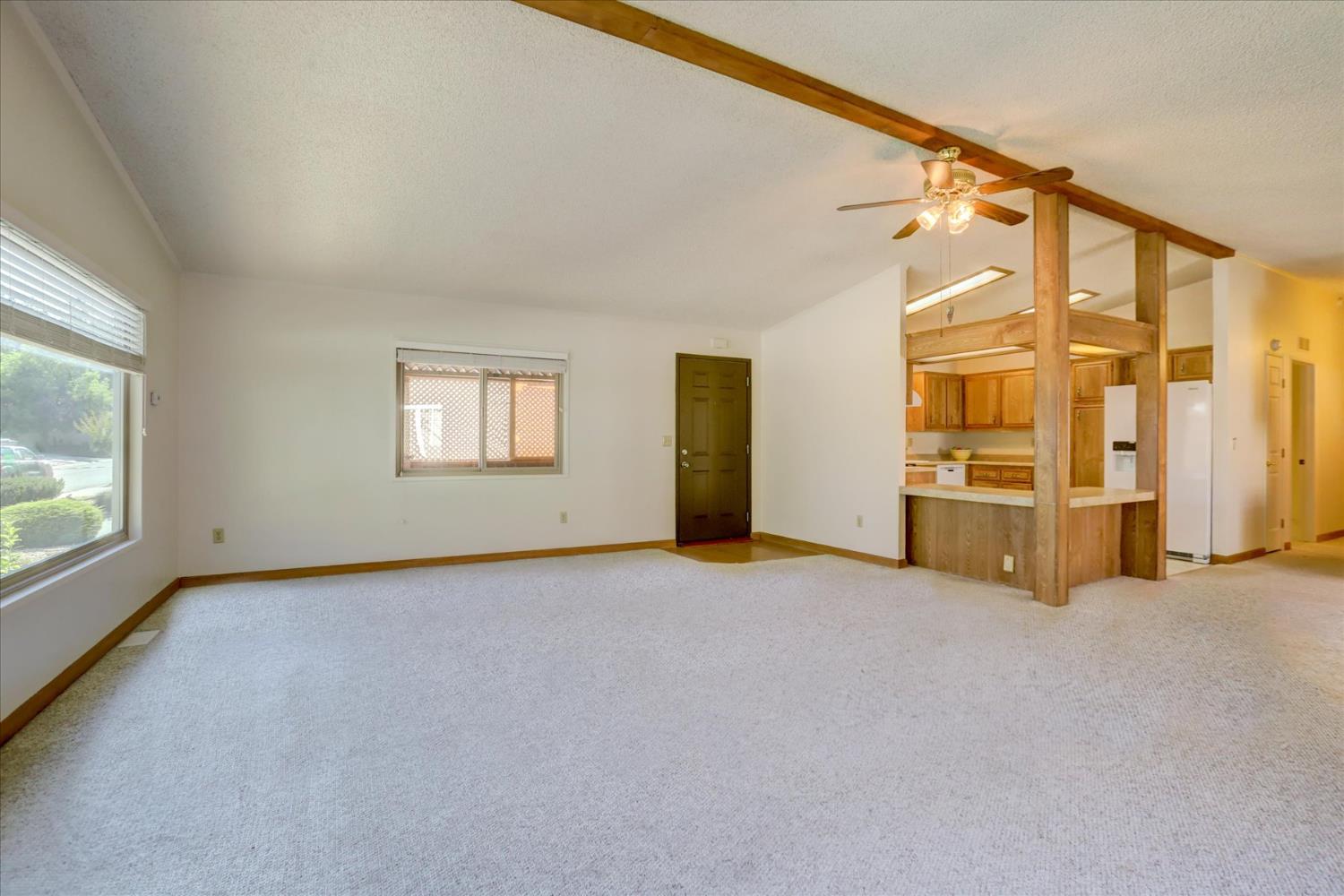 10046 Dalewood Way Grass Valley, CA 95949 - Photo 7 of 68 an empty room with windows and fireplace