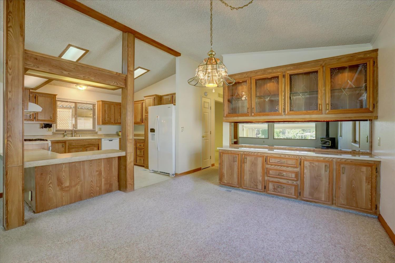 10046 Dalewood Way Grass Valley, CA 95949 - Photo 9 of 68 a large kitchen with granite countertop a lot of counter space and a sink