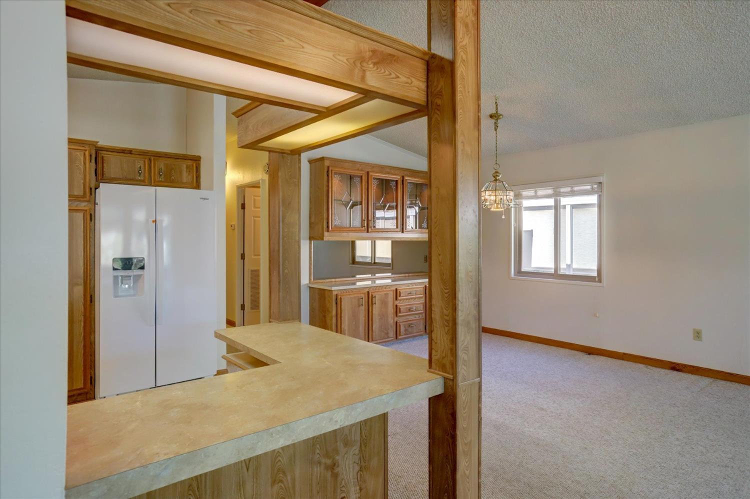 10046 Dalewood Way Grass Valley, CA 95949 - Photo 10 of 68 a view of livingroom with kitchen view and wooden floor
