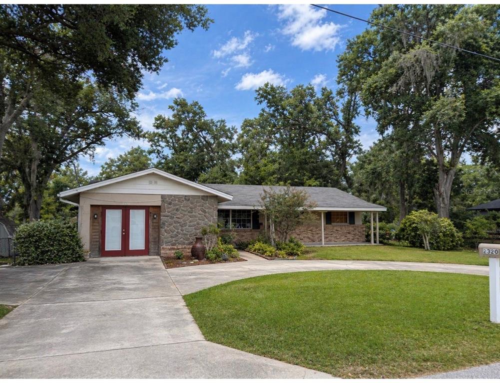 2320 Palm Avenue Seffner, FL 33584 - Photo 1 of 15 a front view of a house with a garden