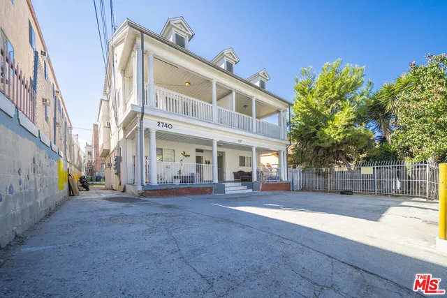 a view of a building with a street