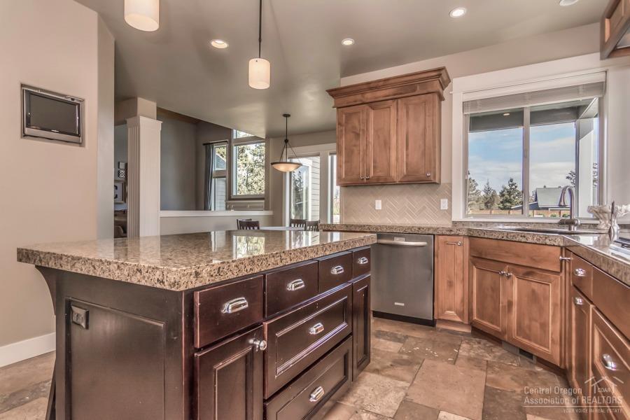 63528 Old Deschutes Road Bend, OR 97701 - Photo 13 of 25 a kitchen with a sink a counter space appliances and cabinets
