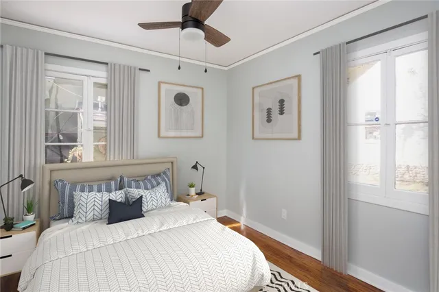 a bedroom with a large bed and a window