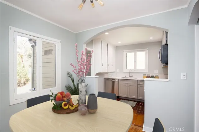 a kitchen with furniture and window