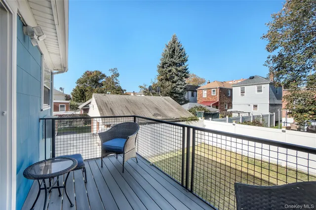 a view of balcony with wooden floor and seating space