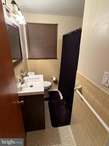 a bedroom with a bed and a television