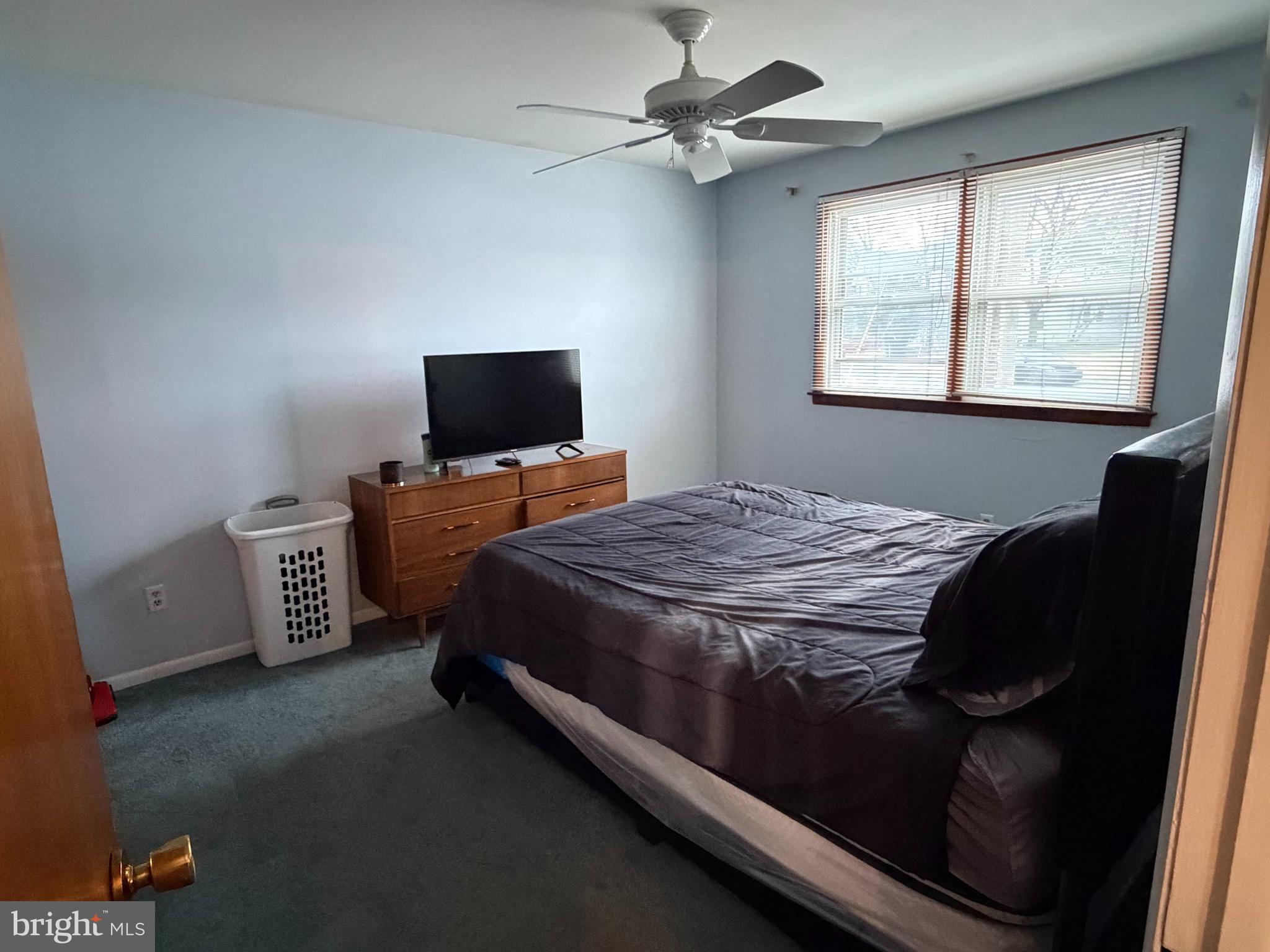 221 West 3rd Street Palmyra, NJ 08065 - Photo 13 of 20 a bedroom with a bed and a television