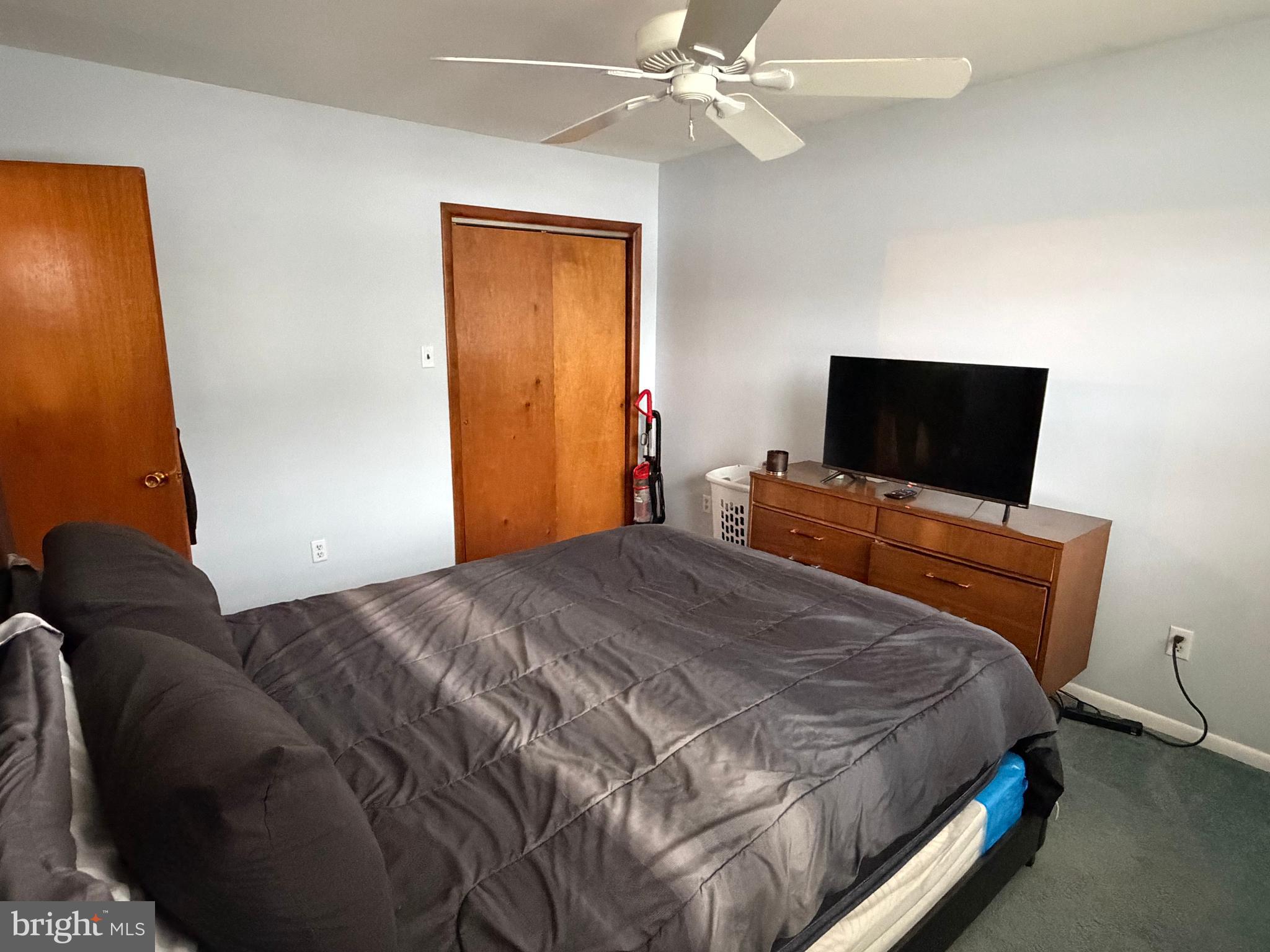 221 West 3rd Street Palmyra, NJ 08065 - Photo 14 of 20 a bedroom with a bed and a flat screen tv