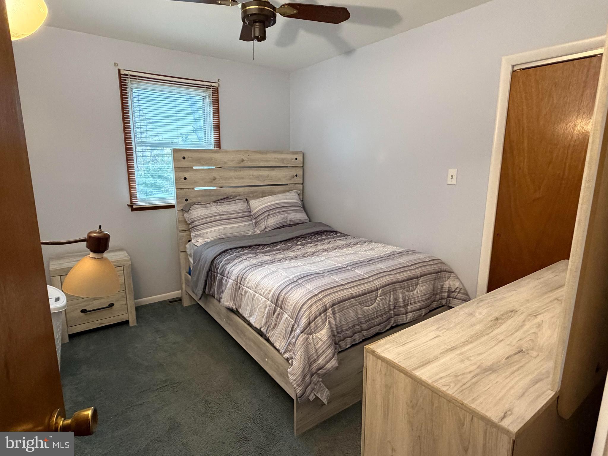 221 West 3rd Street Palmyra, NJ 08065 - Photo 15 of 20 a bedroom with a bed and wooden floor