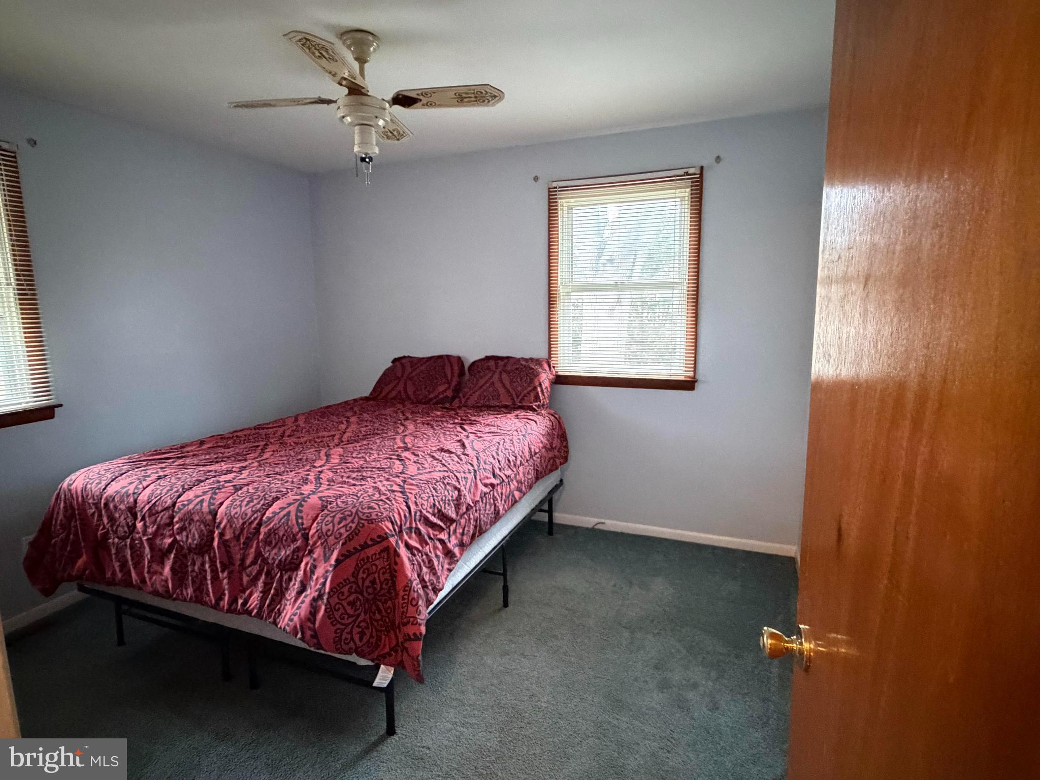 221 West 3rd Street Palmyra, NJ 08065 - Photo 16 of 20 a bedroom with a bed and window