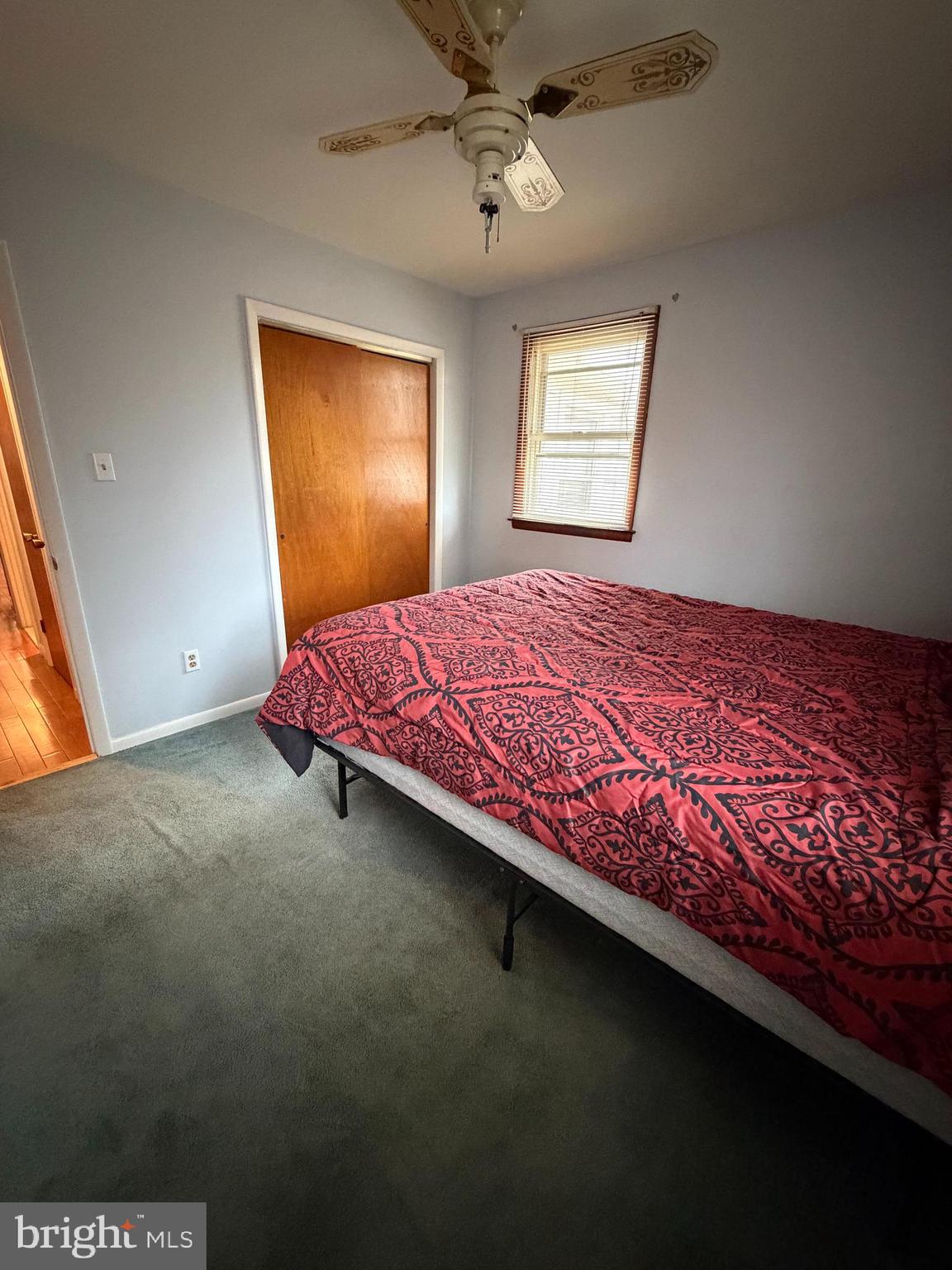 221 West 3rd Street Palmyra, NJ 08065 - Photo 17 of 20 a bed sitting in a bedroom next to a window