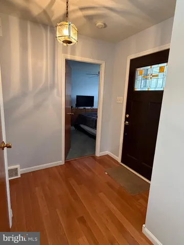 a view of gallery with wooden floor